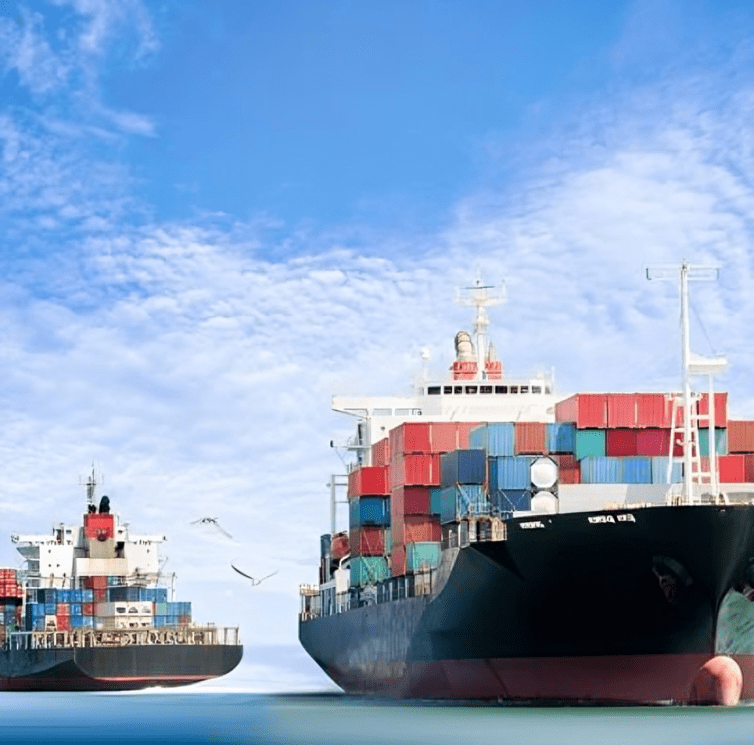 rs=w_400,cg_true (2) Cargo ships sailing under a blue sky.